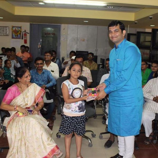 Presented Gifts to Meritorious Students of Share Holders of RNSB Surendranagar Branch.
